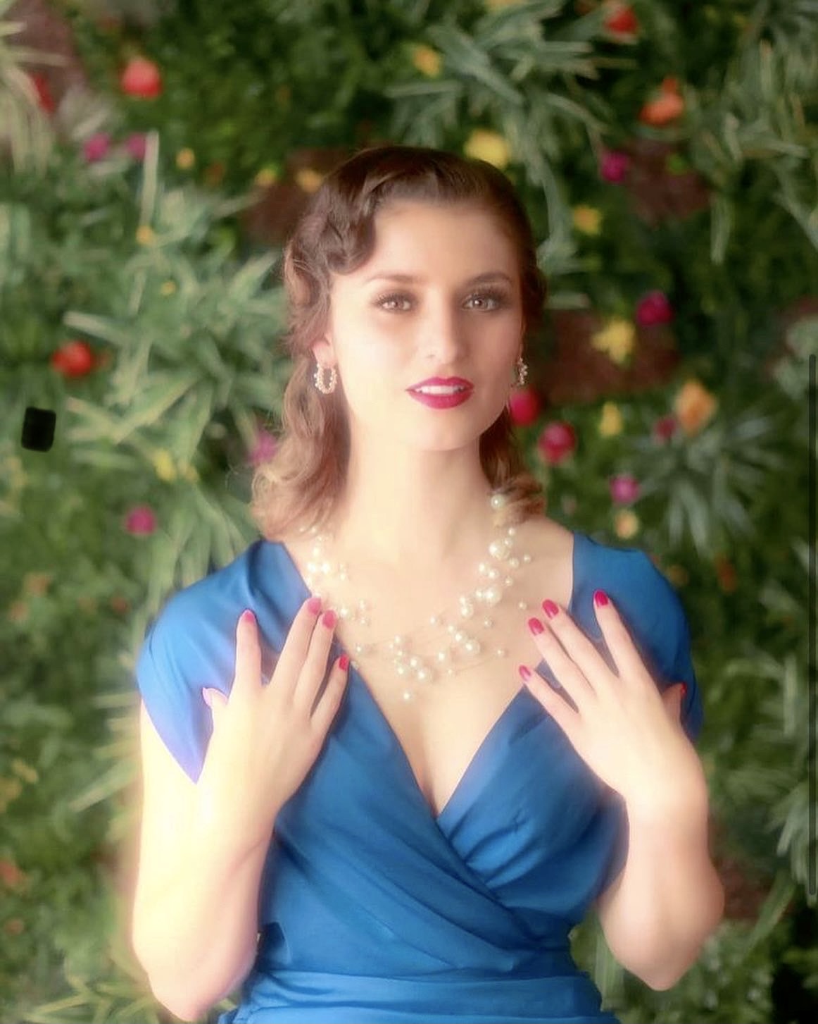 Shannon Kitchen in a blue dress and pearls